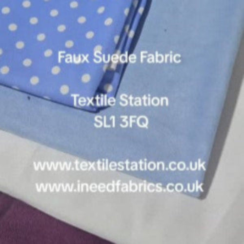 Stack of faux suede fabric swatches with visible patterns and colors, including blue with white polka dots.
